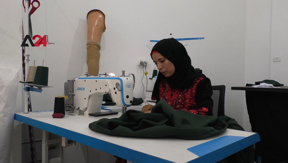 Palestine - Despite her foot amputation... Gaza woman starts business for designing and sewing clothes