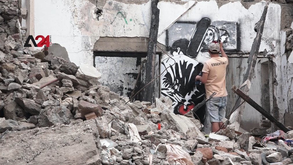 Yemen - Artist documents war effects with murals on destroyed homes